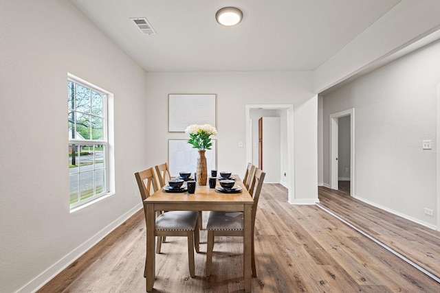 1031 W Chestnut St, Denison, TX 75020 - dining room featuring light wood-type flooring and baseboards