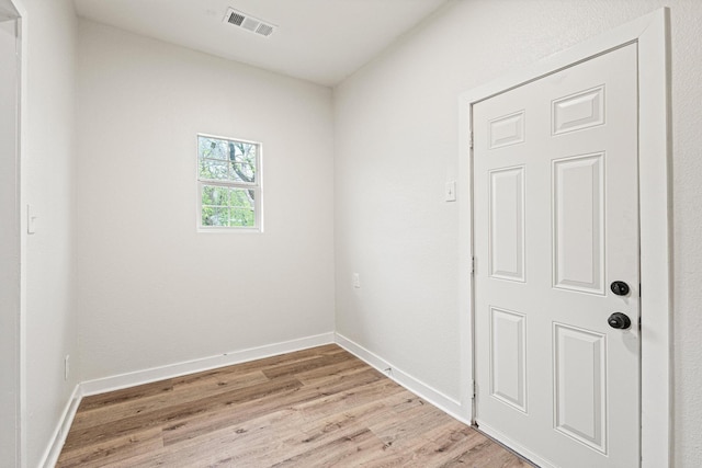 1031 W Chestnut St, Denison, TX 75020 - empty room with light wood finished floors and baseboards