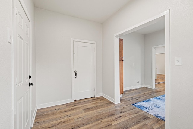 1031 W Chestnut St, Denison, TX 75020 - foyer entrance with wood finished floors and baseboards
