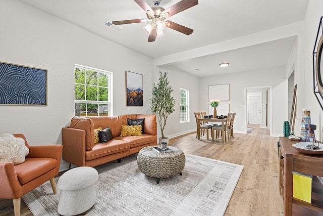 1031 W Chestnut St, Denison, TX 75020 - living room featuring light wood-style flooring, a ceiling fan, and baseboards