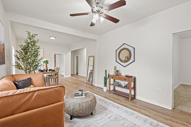 1031 W Chestnut St, Denison, TX 75020 - living room featuring light wood-style floors, ceiling fan, and baseboards