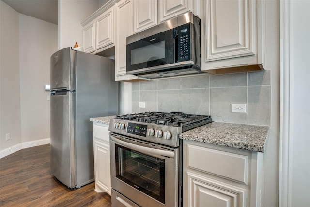 1400 Stone Ridge Dr, Anna, TX 75409 - kitchen featuring light stone counters, tasteful backsplash, stainless steel appliances, baseboards, and dark wood-style floors