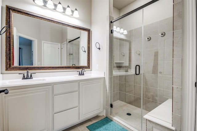 1400 Stone Ridge Dr, Anna, TX 75409 - bathroom featuring tile patterned flooring, a sink, double vanity, and a stall shower