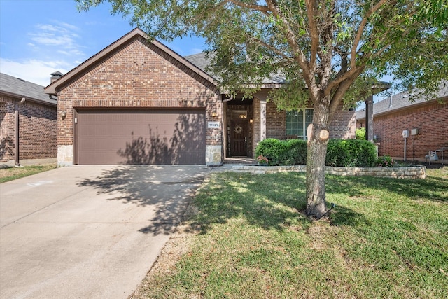 view of front of house featuring brick siding, an attached garage, a front lawn, and concrete driveway