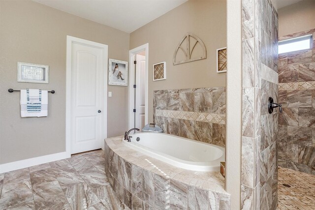 full bath featuring a bath and walk in shower