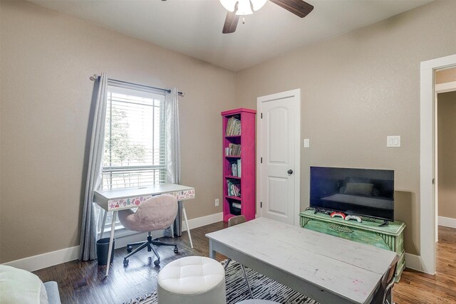 office space with ceiling fan, baseboards, and wood finished floors