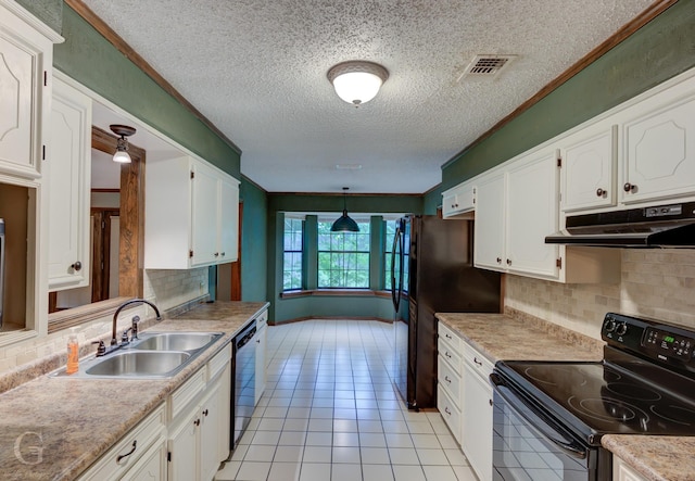 kitchen featuring a sink, a textured ceiling, black appliances, under cabinet range hood, and visible vents