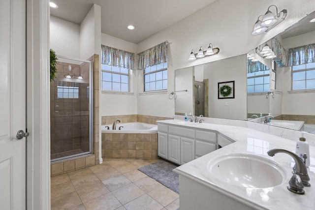 1027 Addison Ave, Pottsboro, TX 75076 - full bathroom featuring a stall shower, plenty of natural light, a garden tub, and double vanity