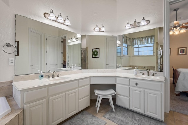 1027 Addison Ave, Pottsboro, TX 75076 - ensuite bathroom featuring tile patterned floors, double vanity, and tiled bath
