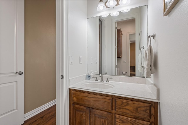 1027 Addison Ave, Pottsboro, TX 75076 - half bath with vanity, wood finished floors, and baseboards