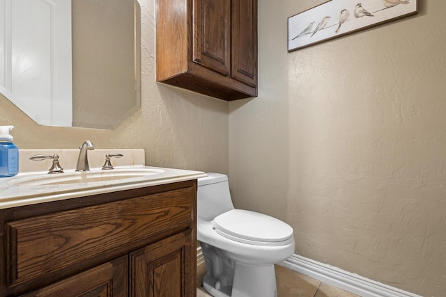 1027 Addison Ave, Pottsboro, TX 75076 - half bath featuring toilet, vanity, a textured wall, tile patterned floors, and baseboards