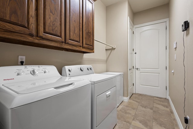 1027 Addison Ave, Pottsboro, TX 75076 - laundry area featuring cabinet space, washing machine and clothes dryer, and baseboards