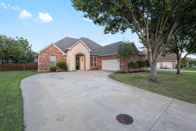 1027 Addison Ave, Pottsboro, TX 75076 - view of front of property with driveway, brick siding, a garage, and a shingled roof