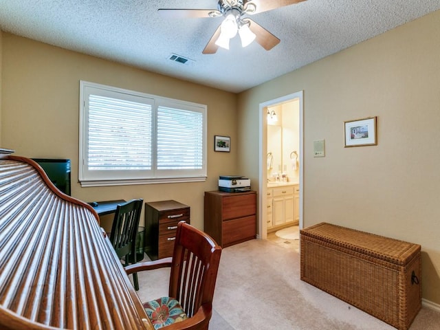 bedroom featuring carpet flooring, a textured ceiling, and visible vents