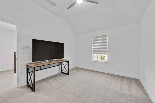 unfurnished living room with carpet, vaulted ceiling, visible vents, baseboards, and ceiling fan