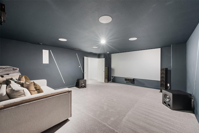 carpeted home theater with recessed lighting, a textured ceiling, and baseboards