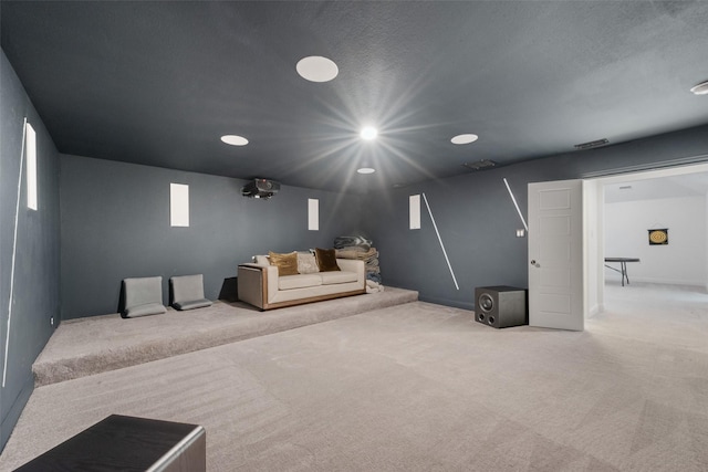 cinema room featuring visible vents, carpet flooring, and recessed lighting