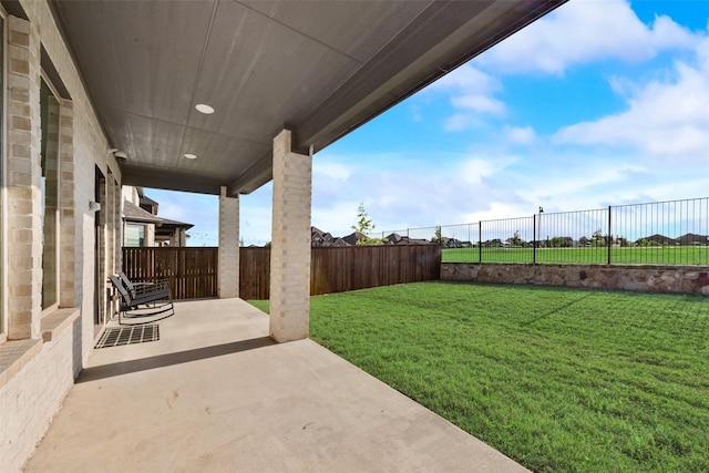 view of yard featuring a fenced backyard and a patio