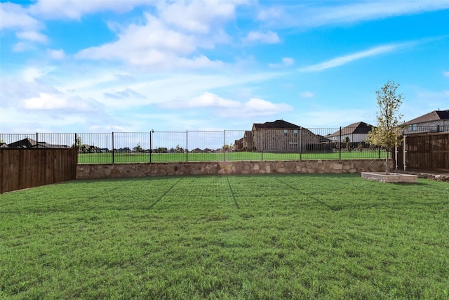 view of yard featuring fence