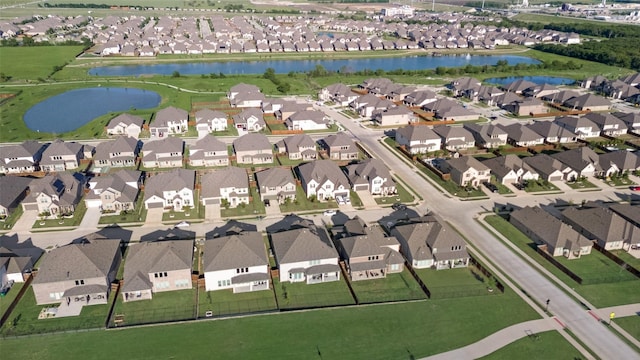 aerial view featuring a water view and a residential view
