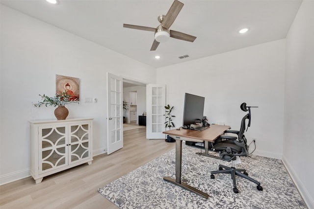 home office featuring a ceiling fan, wood finished floors, french doors, baseboards, and visible vents