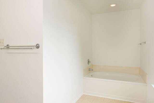 full bath with recessed lighting, tile patterned floors, baseboards, and a bath