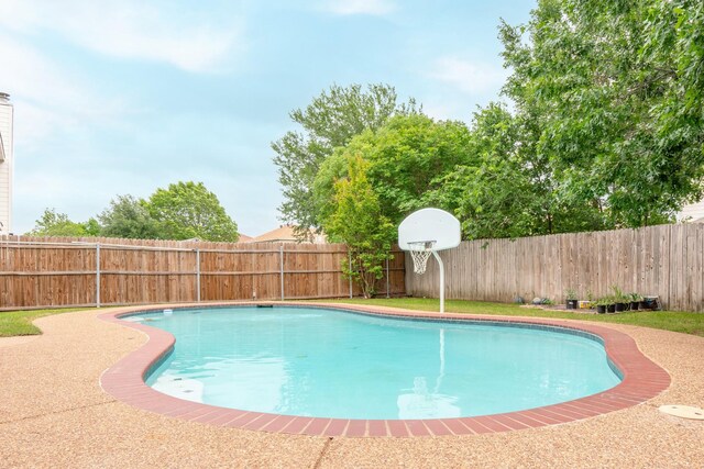 view of swimming pool featuring a fenced in pool and a fenced backyard