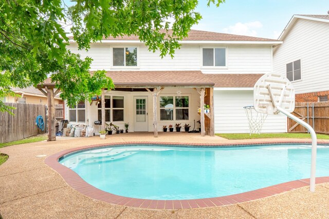 view of swimming pool featuring a fenced in pool, a fenced backyard, and a patio area