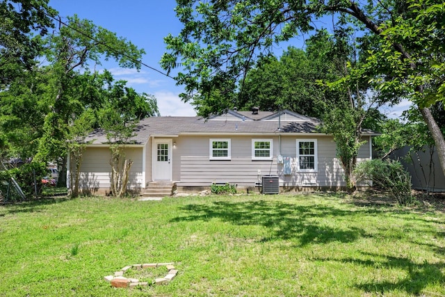 2224 Tisinger Ave, Dallas, TX 75228 - rear view of house with a yard, central air condition unit, and entry steps