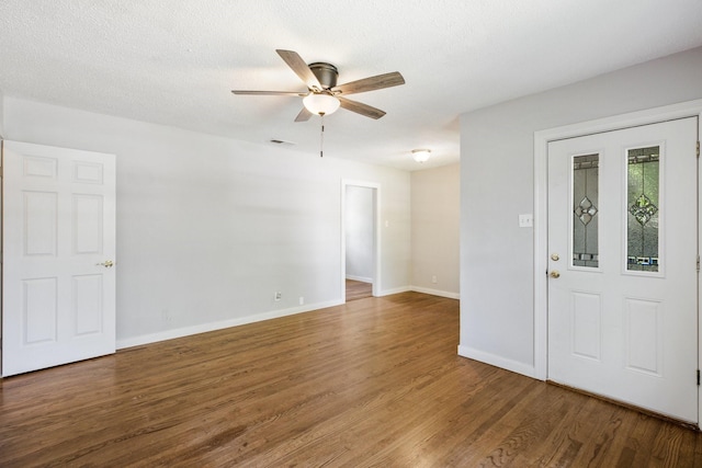 2224 Tisinger Ave, Dallas, TX 75228 - unfurnished room featuring a ceiling fan, visible vents, wood finished floors, and baseboards