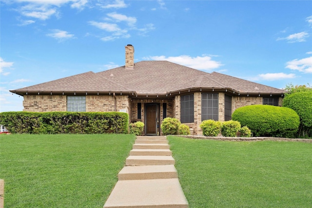 620 Linda Dr, Burleson, TX 76028 - view of front facade with brick siding, a chimney, a front yard, and a shingled roof