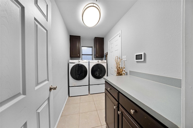 620 Linda Dr, Burleson, TX 76028 - clothes washing area with cabinet space, light tile patterned floors, and washer and clothes dryer