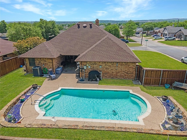 620 Linda Dr, Burleson, TX 76028 - view of swimming pool with central AC unit, a fenced backyard, a yard, a patio, and a fenced in pool
