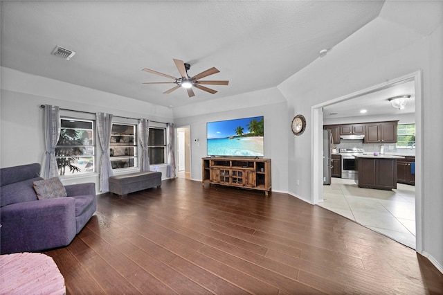 620 Linda Dr, Burleson, TX 76028 - living area with ceiling fan, baseboards, visible vents, and light wood-style flooring