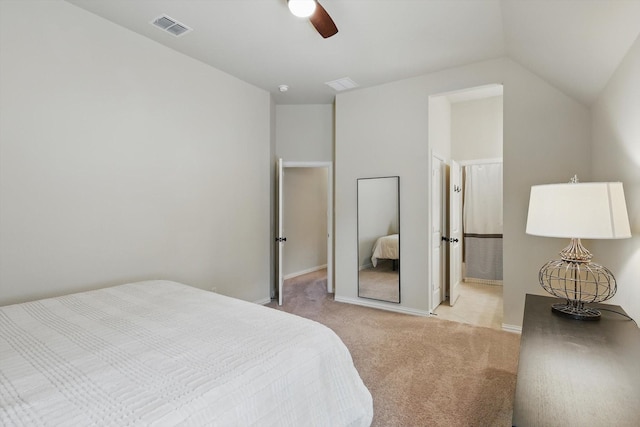 carpeted bedroom with baseboards, visible vents, ceiling fan, and vaulted ceiling