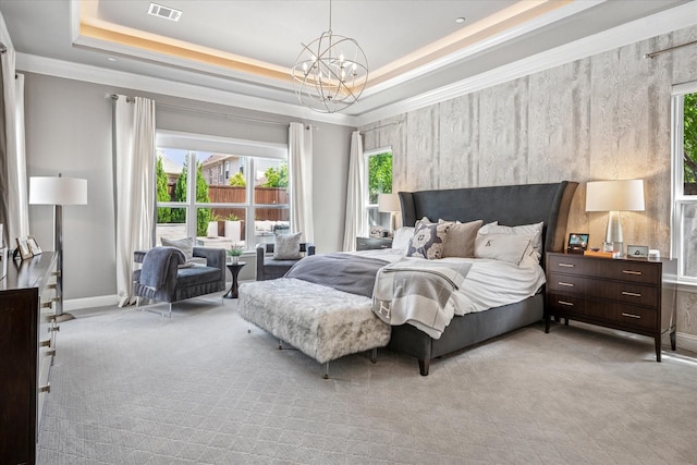 13508 Balint Ln, Frisco, TX 75035 - bedroom featuring visible vents, a notable chandelier, light colored carpet, crown molding, and a raised ceiling