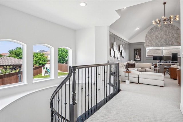 13508 Balint Ln, Frisco, TX 75035 - hallway featuring vaulted ceiling, recessed lighting, an inviting chandelier, an upstairs landing, and carpet floors