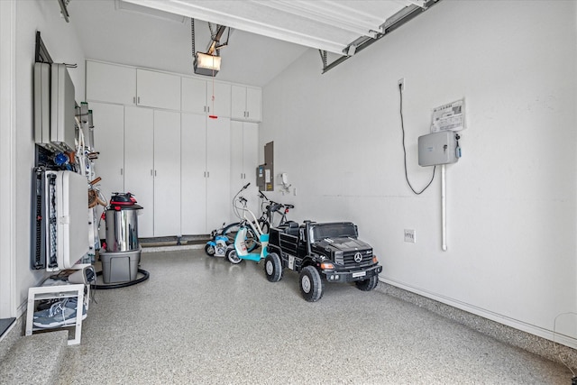 13508 Balint Ln, Frisco, TX 75035 - garage featuring electric panel and a garage door opener