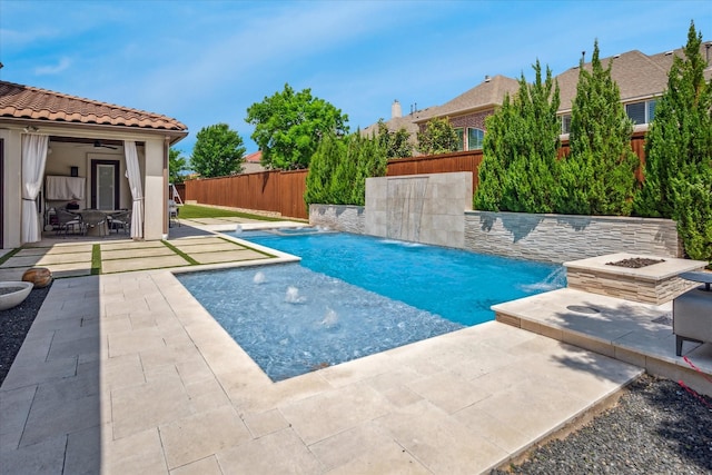 13508 Balint Ln, Frisco, TX 75035 - view of swimming pool with a fenced in pool, a fenced backyard, ceiling fan, a patio, and an outdoor fire pit