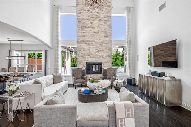 13508 Balint Ln, Frisco, TX 75035 - living area featuring a high ceiling, a notable chandelier, and dark wood finished floors