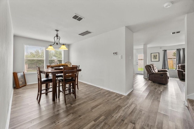 5712 Goldfinch Way, Dallas, TX 75249 - dining room with visible vents and a healthy amount of sunlight
