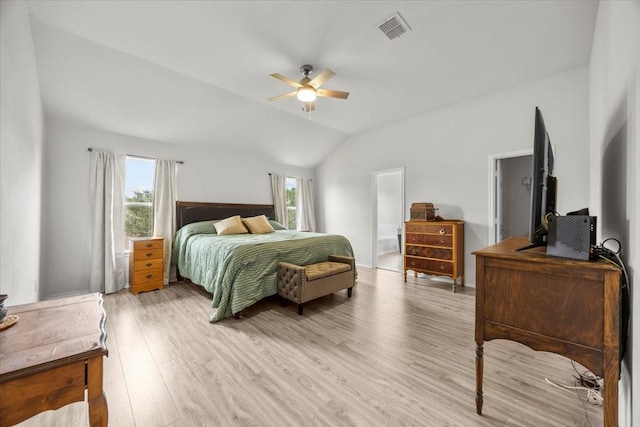 5712 Goldfinch Way, Dallas, TX 75249 - bedroom with visible vents, light wood-style floors, a ceiling fan, ensuite bath, and vaulted ceiling