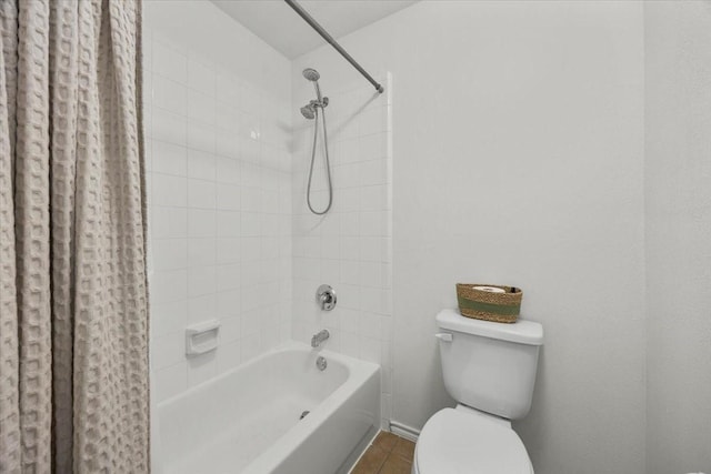 5712 Goldfinch Way, Dallas, TX 75249 - full bathroom with tile patterned floors, baseboards, shower / bath combo with shower curtain, and toilet