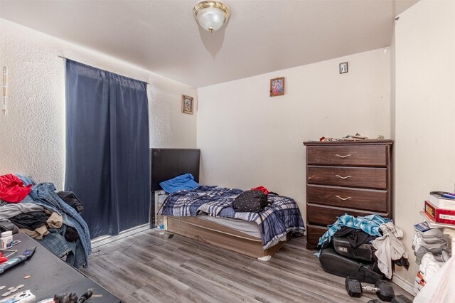 bedroom featuring wood finished floors