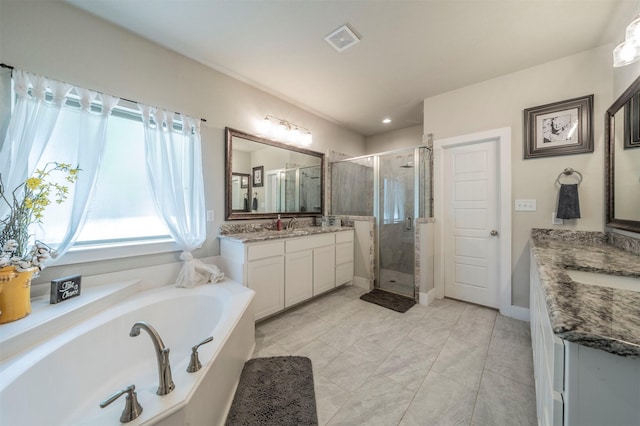 2033 Antler Loop, Poolville, TX 76487 - bathroom with a shower stall, a garden tub, and two vanities