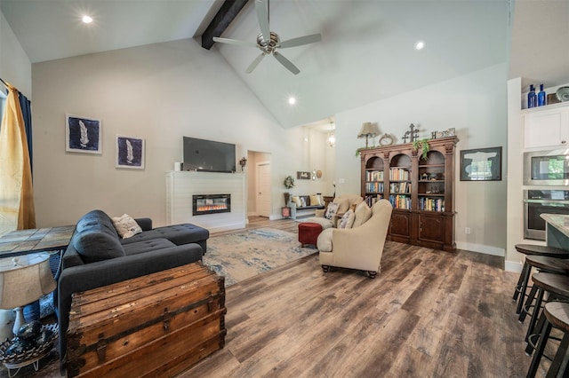 2033 Antler Loop, Poolville, TX 76487 - living room with high vaulted ceiling, beam ceiling, dark wood-style flooring, ceiling fan, and a glass covered fireplace