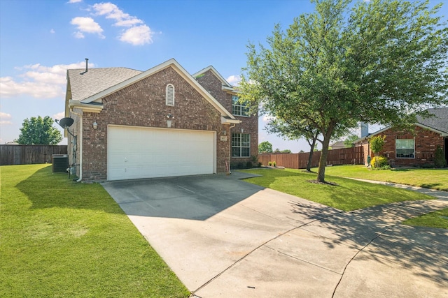 traditional-style home featuring brick siding, concrete driveway, a front yard, and fence
