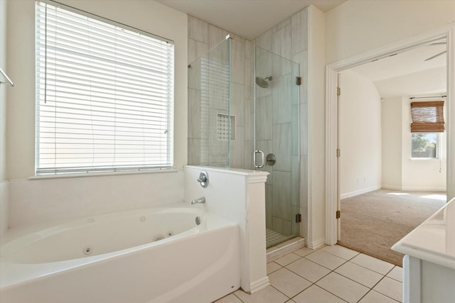 403 Connemara Trl, Celina, TX 75009 - full bath with a whirlpool tub, a shower stall, tile patterned floors, vanity, and baseboards