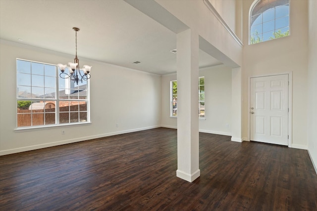 403 Connemara Trl, Celina, TX 75009 - entrance foyer featuring healthy amount of natural light, a chandelier, dark wood finished floors, crown molding, and baseboards