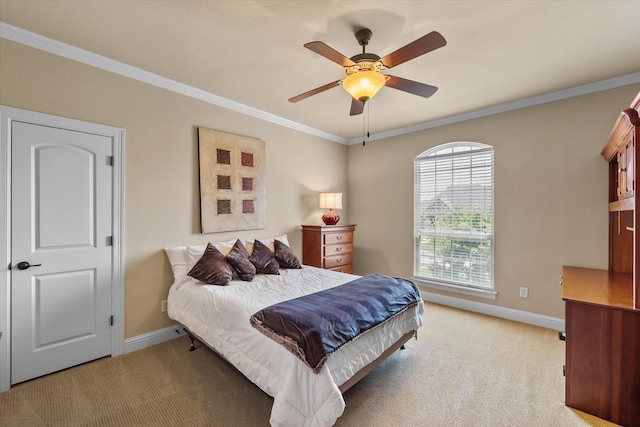 bedroom featuring baseboards, a ceiling fan, light colored carpet, and ornamental molding
